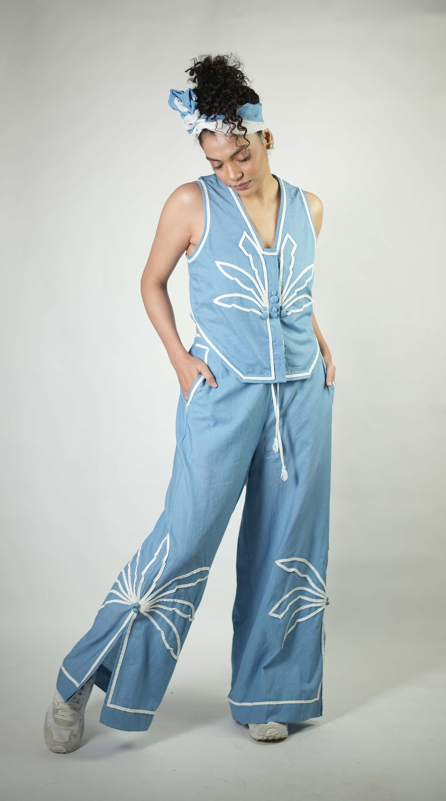 Hand stitched palm tree motif detailing top with back detailing