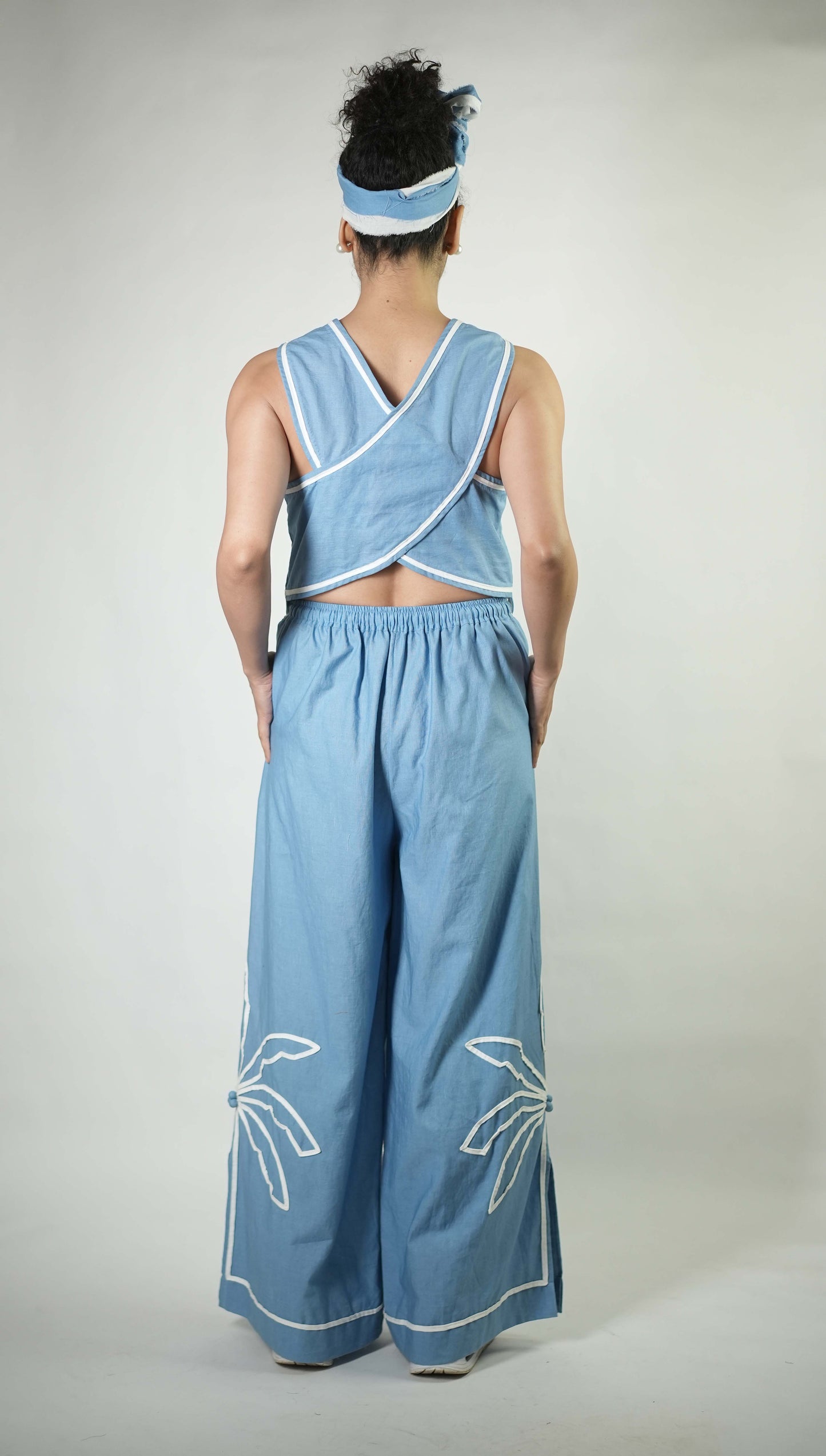 Hand stitched palm tree motif detailing top with back detailing